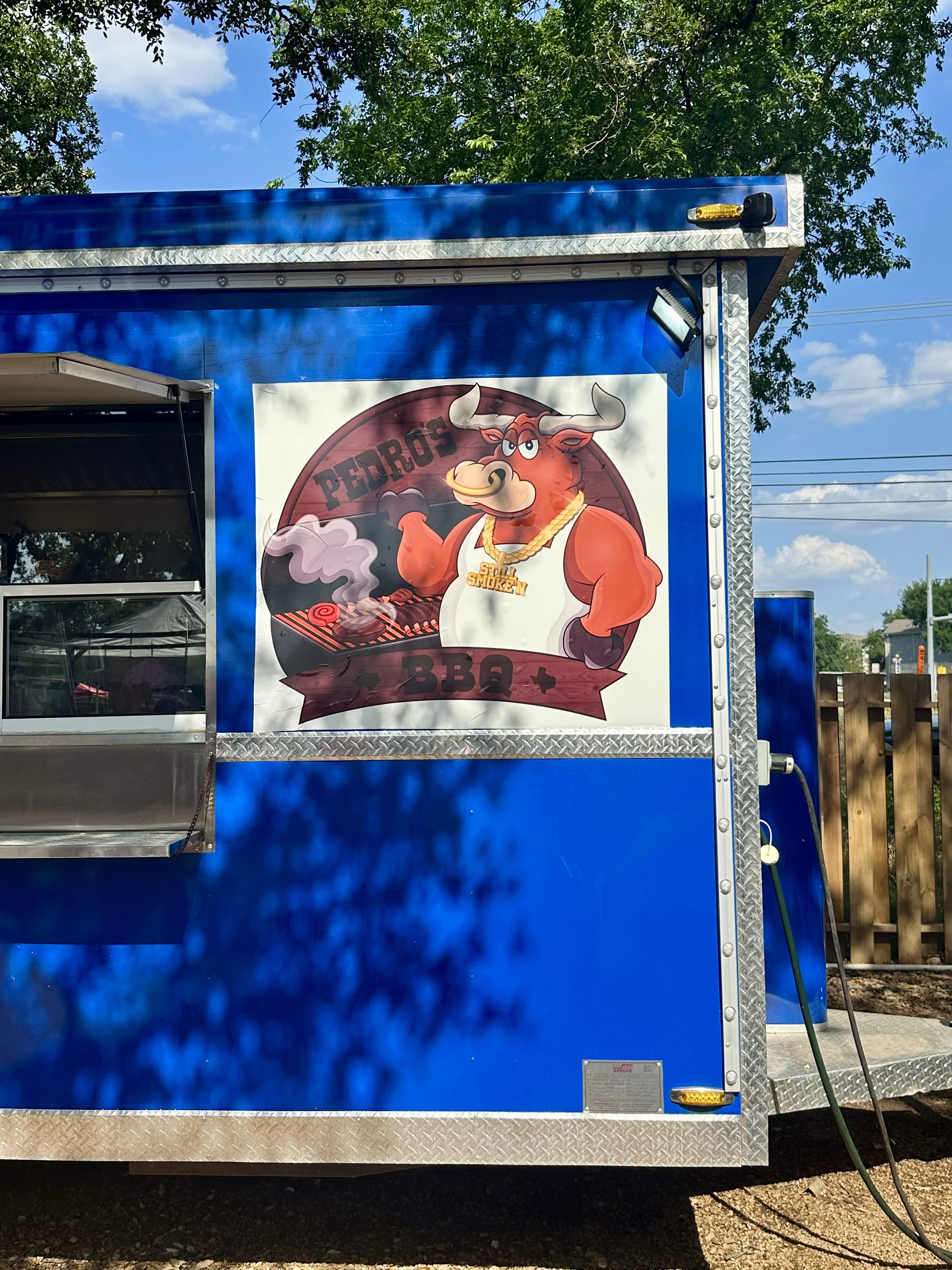 Pedro's BBQ - Pedro's BBQ outdoor seating and smoker