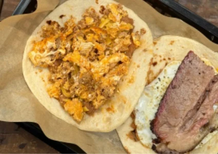 Breakfast Tacos - Handmade tortillas stuffed with brisket, egg, and all your favorite fillings. The best breakfast tacos in Austin.
